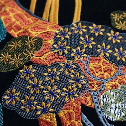 Giraffe embroidered velvet cushion